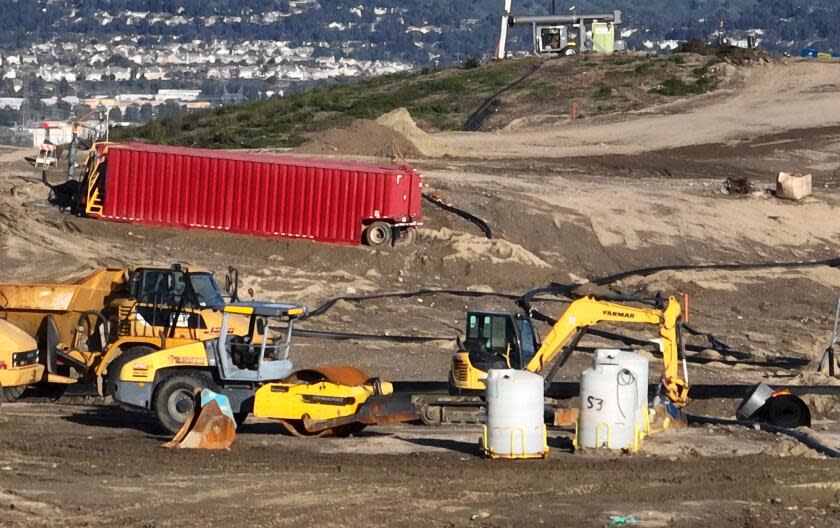 Castaic, CA - February 22: An aerial view of equipment where contaminated or polluted water is being extracted to fill roughly 100 metal storage containers, holding up to 20,000 gallons each as the result of an underground landfill fire at Chiquita Canyon Landfill in Castaic Thursday, Feb. 22, 2024. Around 200,000 gallons of the contaminated water is coming out of the landfill each day. Environmental regulators have found elevated levels of cancer causing Benzine in the polluted water spilling onto the surface of the landfill. Landfill operators are also constructing a drainage system to capture the contaminated water that is spilling onto the surface and proactively pumping the water. Residents of Val Verde and Castaic are protesting to call for Chiquita Canyon Landfill to be closed in Hasley Canyon Park in Castaic. Garbage has been burning deep inside the landfill due to a chemical reaction for much of the past year, and recently scalding-hot contaminated water has surged to the surface. The protest follows calls from the County Supervisor Kathryn Barger's office, which said the landfill should provide funds to relocate residents who want to temporarily move until the issue is resolved. (Allen J. Schaben / Los Angeles Times)