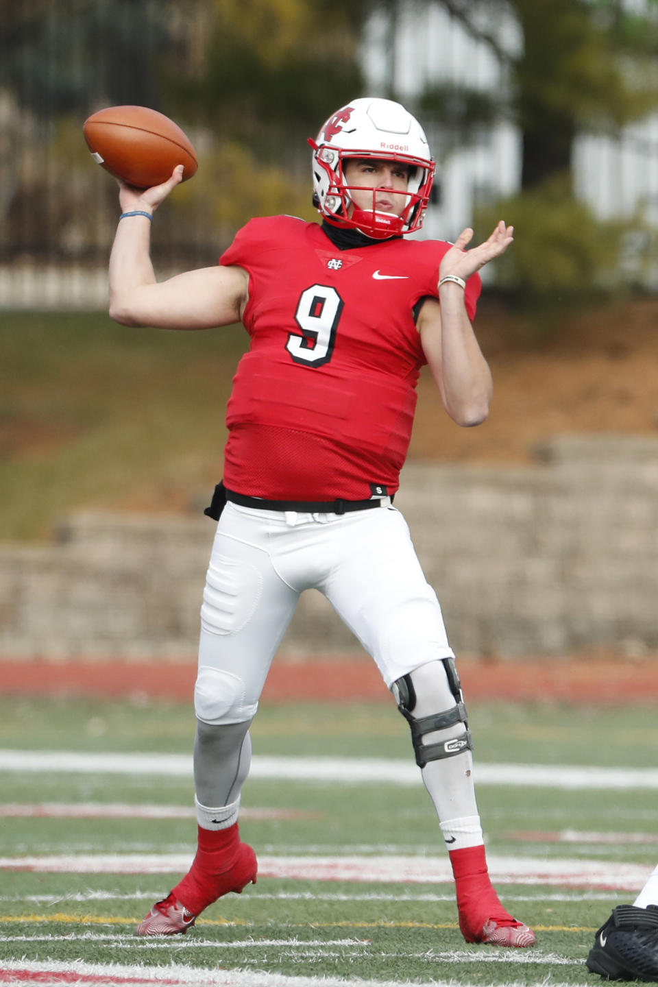 In this Nov. 23, 2019 photo, provided by North Central College Athletics, North Central quarterback Broc Rutter throws a pass against Wabash during an NCAA college football game in Naperville, Ill. Rutter was selected to the Division III All-America first team on Thursday, Dec. 19, 2019. (Steve Woltmann/North Central College Athletics via AP)