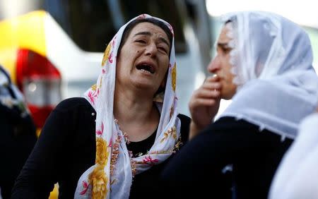 Women mourn as they wait in front of a hospital morgue in the Turkish city of Gaziantep, after a suspected bomber targeted a wedding celebration in the city, Turkey, August 21, 2016. REUTERS/Osman Orsal