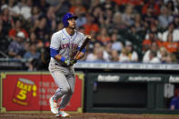 New York Mets' Eduardo Escobar watches his home run against the Houston Astros during the seventh inning of a baseball game Tuesday, June 21, 2022, in Houston. (AP Photo/David J. Phillip)