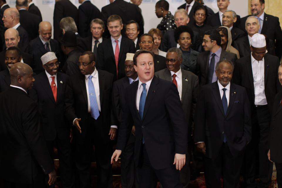 British Prime Minister David Cameron, center front, gathers for a group photograph with delegates during the London Conference on Somalia at Lancaster House in London, Thursday, Feb. 23, 2012. Nations must help Somalia's fragile leadership tackle terrorism, piracy and hunger or be prepared to pay the price, Britain's leader warned Thursday at an international conference on the troubled east African nation's future. About 50 nations and international organizations attended a one-day summit hosted by Prime Minister David Cameron in London, including Somalia's Western-backed transitional government, U.S. Secretary of State Hillary Rodham Clinton and United Nations Secretary-General Ban Ki-moon. (AP Photo/Matt Dunham-Pool)