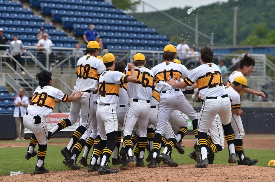 Players celebrate on the mound after winning 4-2 over Fayetteville-Manlius.