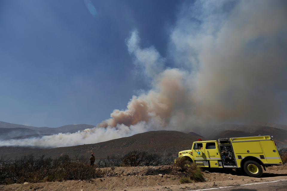 Firefighters keep watch on the Blue Cut fire