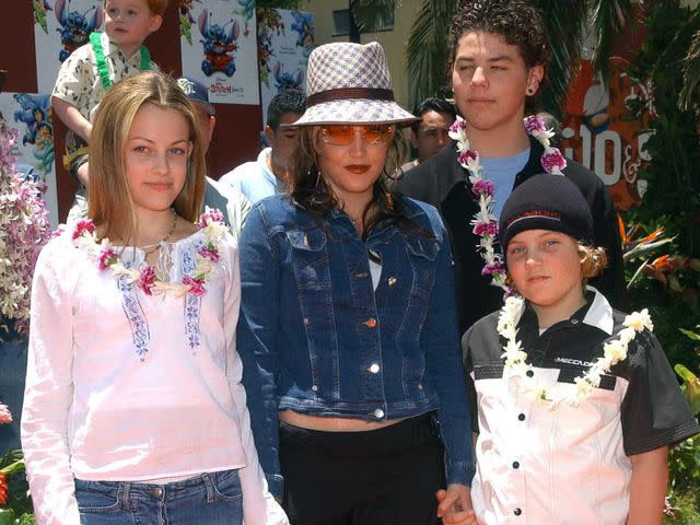 <p>CHRIS DELMAS/AFP/Getty </p> Lisa Marie Presley and her kids, Benjamin, Riley and Navarone, at the premiere of "Lilo and Stitch" in June 2002 in Hollywood, California.