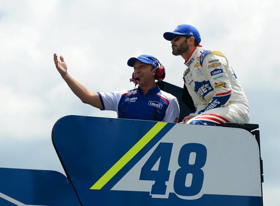 NASCAR crew chief Chad Knaus, left and driver Jimmie Johnson, right, talk atop the team’s transporter prior to practice at Charlotte Motor Speedway in Concord, NC on Thursday, May 25, 2017.