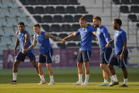 (Left-Right) England's Marcus Rashford, Kieran Trippier, Kalvin Phillips, Luke Shaw and England's Raheem Sterling take part in drills during a training session at Al Wakrah Sports Complex on the eve of the Round of 16 World Cup soccer match between England and Senegal, in Al Wakarah, Qatar, Saturday, Dec. 3, 2022. (AP Photo/Abbie Parr)