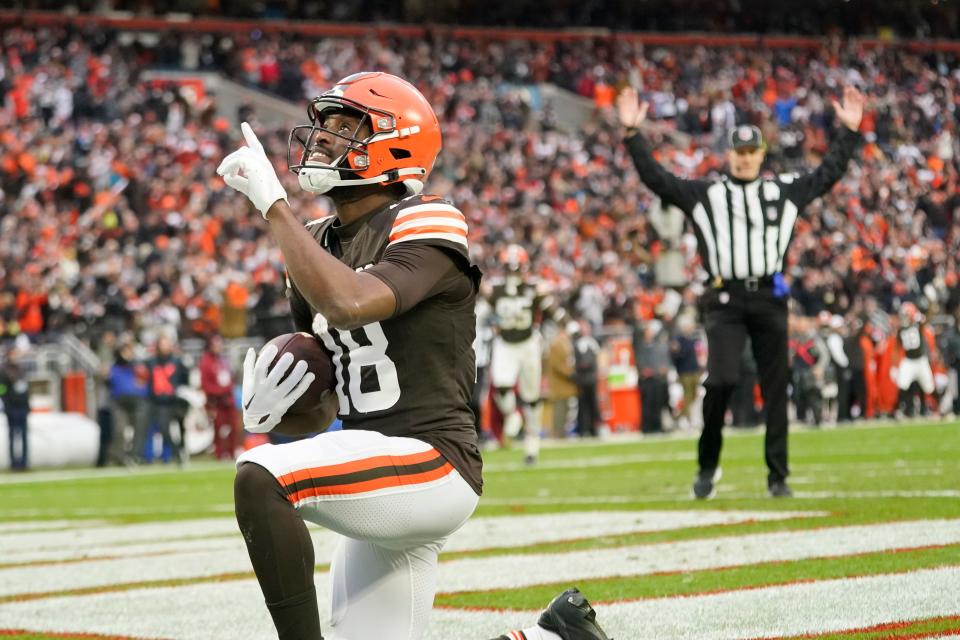 Cleveland Browns wide receiver David Bell (18) knees and looks skyward after catching a 41-yard touchdown pass during the second half Sunday against the Jacksonville Jaguars in Cleveland.