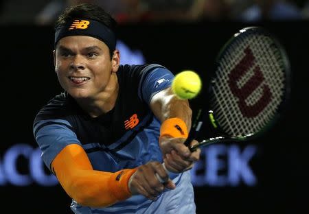 Canada's Raonic hits a shot during his quarter-final match against France's Monfils at the Australian Open tennis tournament at Melbourne Park