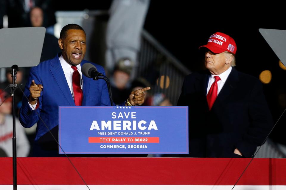 Candidate for Georgia's 10th Congressional District Vernon Jones speaks with former President Donald Trump at a "Save America Rally" at the Banks County Dragway on Saturday, March 26, 2022.