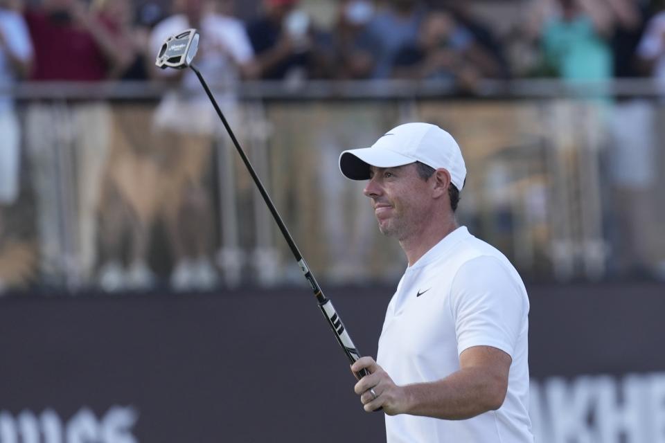 Rory McIlroy of Northern Ireland celebrates after he won the final round of the Hero Dubai Desert Classic golf tournament, in Dubai, United Arab Emirates, Sunday, Jan. 21, 2024. (AP Photo/Kamran Jebreili)