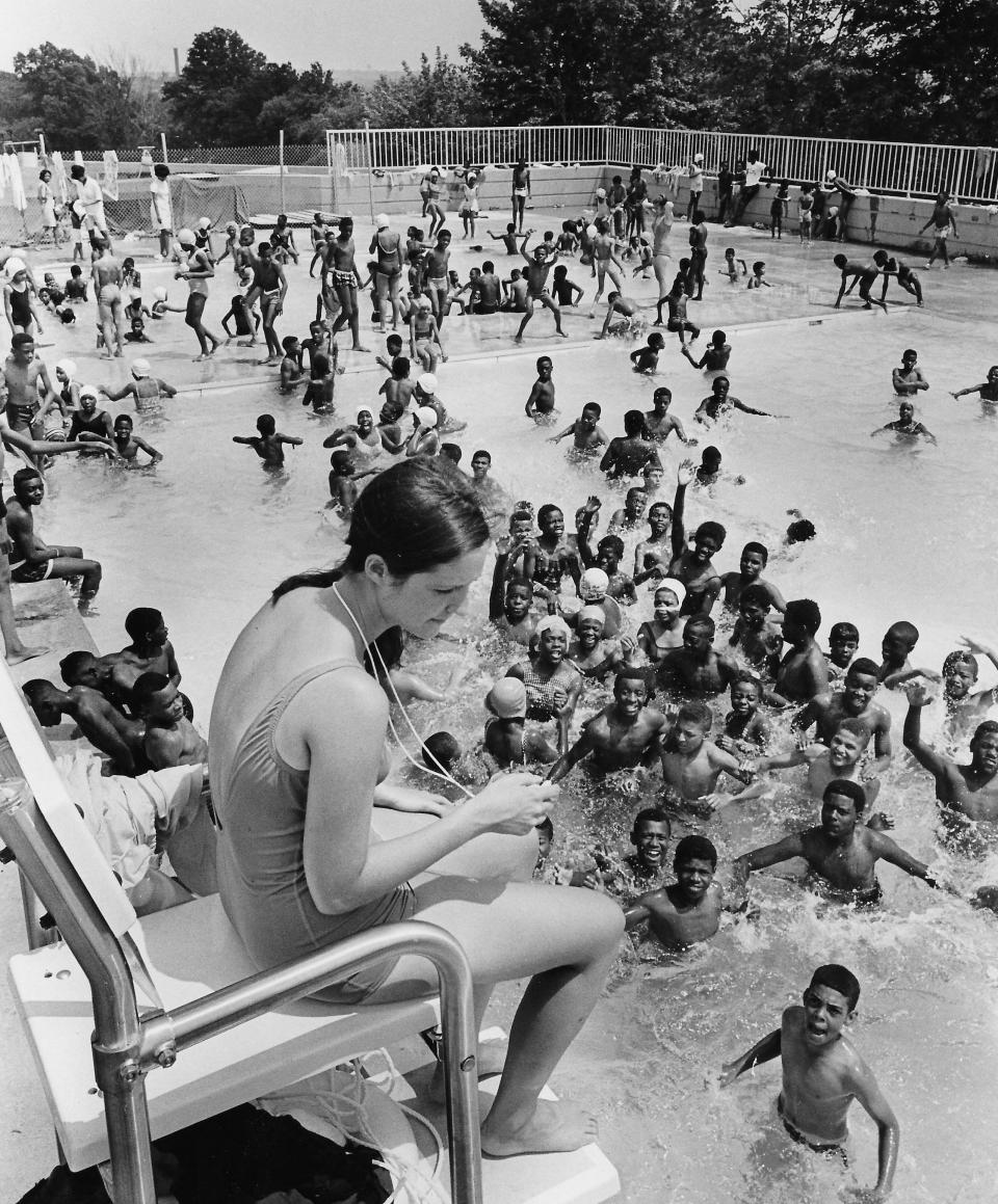 Lifeguard Marilyn Pliskin watches over swimmers July 1, 1968, at the grand opening of Perkins Wood Pool in Akron.