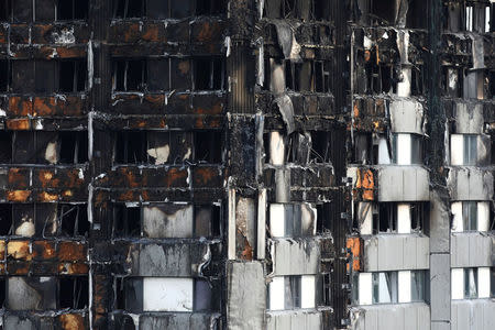 FILE PHOTO: The burnt out remains of the Grenfell apartment tower are seen in North Kensington, London, Britain, June 18, 2017. REUTERS/Neil Hall/File Photo