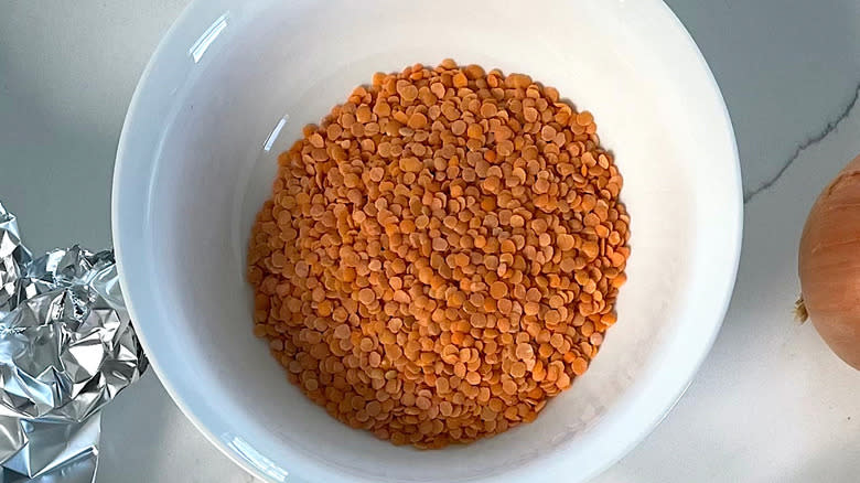 Red lentils in white bowl