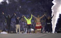 <p>Performers (including Tonga’s flag bearer Pita Taufatofua) take part in the closing ceremony for the 2016 Rio Olympics. (REUTERS/Stoyan Nenov) </p>