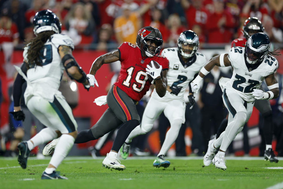 TAMPA, FLORIDA – JANUARY 15: David Moore #19 of the Tampa Bay Buccaneers runs with the ball to score a 44 yard touchdown against the Philadelphia Eagles during the first quarter in the NFC Wild Card Playoffs at Raymond James Stadium on January 15, 2024 in Tampa, Florida. (Photo by Mike Ehrmann/Getty Images)