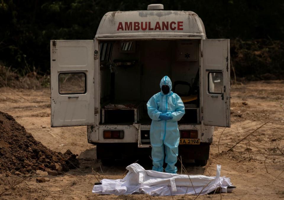 <div class="inline-image__caption"><p>A man offered funeral prayers for a Central Reserve Police Force officer who died from the coronavirus disease (COVID-19), at a graveyard in New Delhi, India, April 29, 2020.</p></div> <div class="inline-image__credit">Danish Siddiqui/Reuters</div>