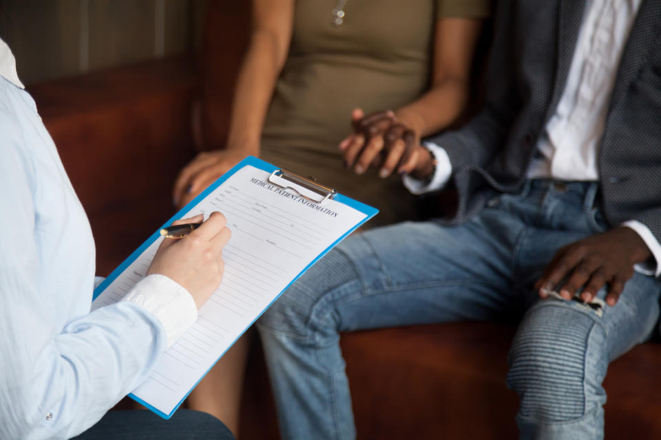 Couple discussing fertility with a doctor. (Getty Images)