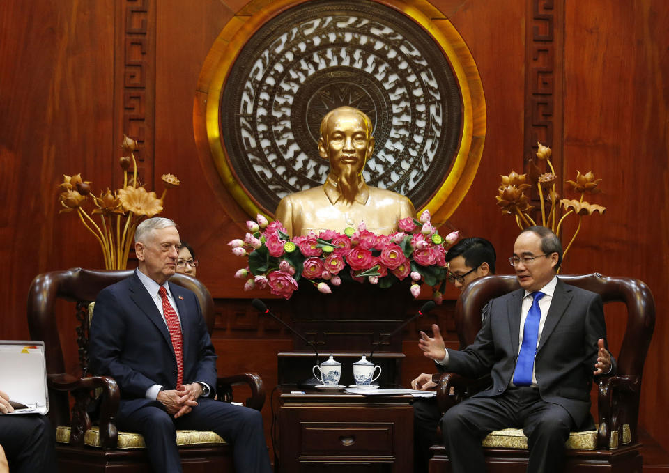 U.S. Defense Secretary Jim Mattis, left, meets Ho Chi Minh City's communist party chief Nguyen Thien Nhan in Ho Chi Minh City, Vietnam Tuesday, Oct. 16, 2018. (Kham/Pool Photo via AP)