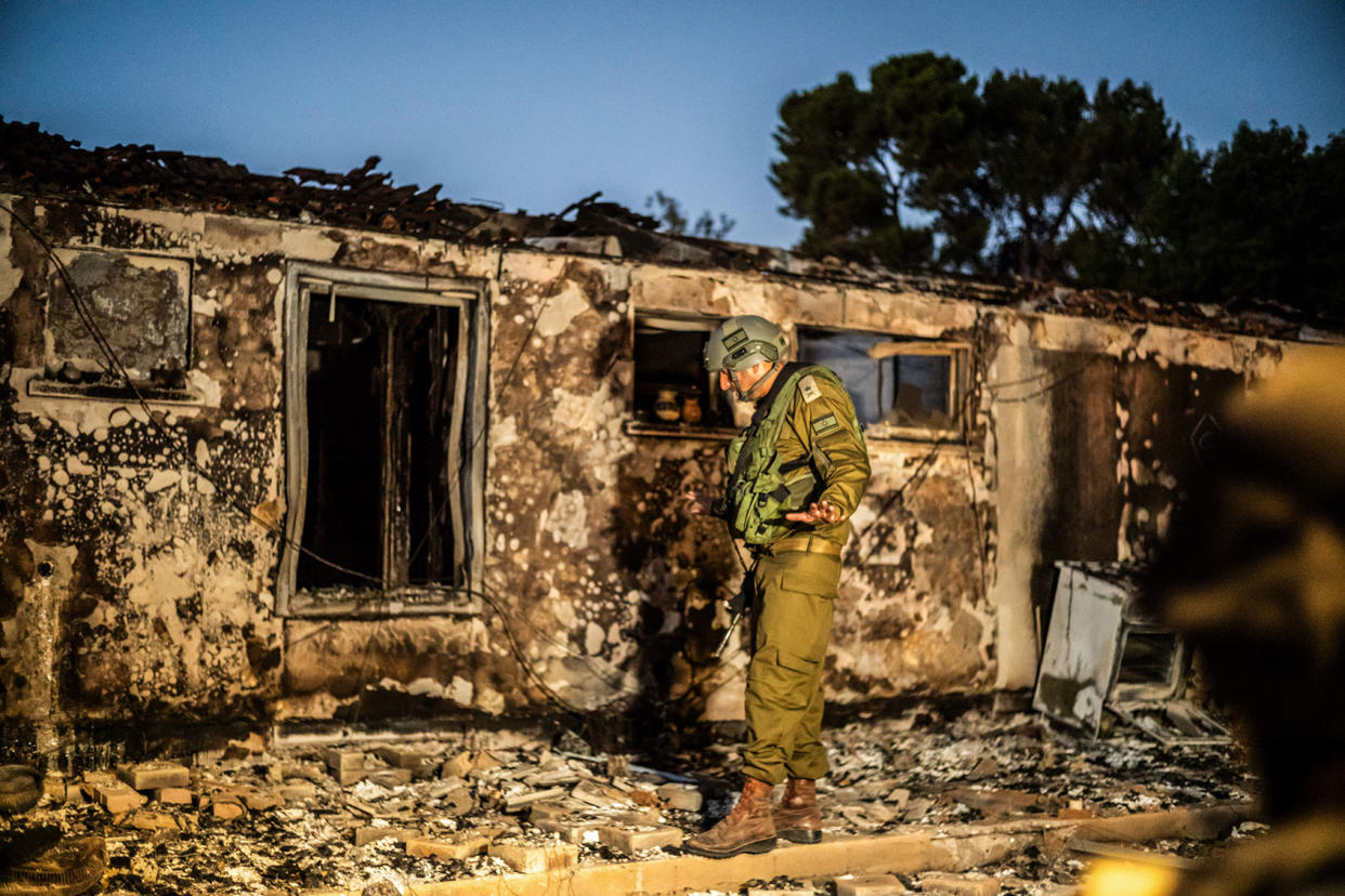 Israeli soldier inspects a destroyed house Ilia Yefimovich/picture alliance via Getty Images