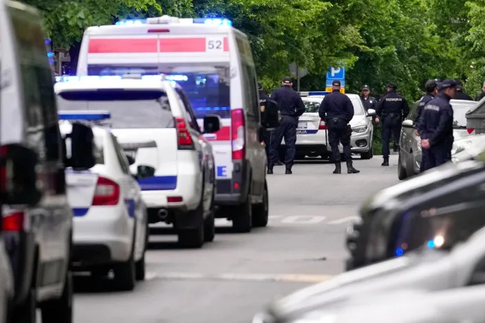 Police block streets around the Vladislav Ribnikar school (AP)