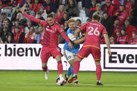 St. Louis City SC defenders Jake Nerwinski (2) and Tim Parker (26) defend against Charlotte FC forward Karol Swiderski, center, during the second half of an MLS soccer match Saturday, March 4, 2023, in St. Louis. (AP Photo/Joe Puetz)