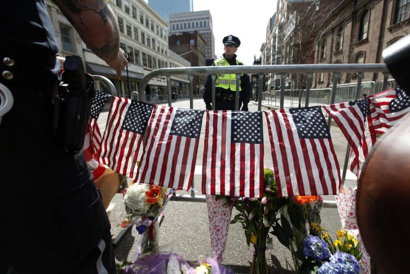 Boston police officers stand guard at the entrance to Boylston Street on April 16, 2013. On April 15, 2013, two pressure-cooker bombs exploded near the finish line of the Boston Marathon, killing three people and injuring more than 260. File Photo by Matthew Healey/UPI