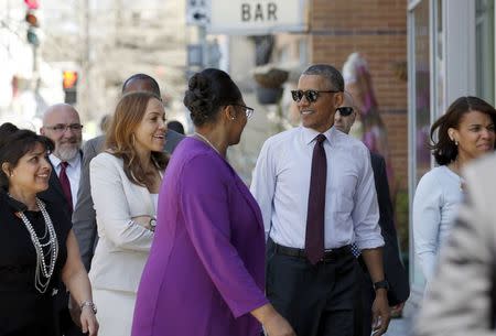 U.S. President Barack Obama arrives at a restaurant to meet with formerly incarcerated individuals who have previously received commutations from his and previous administrations in Washington March 30, 2016.REUTERS/Kevin Lamarque