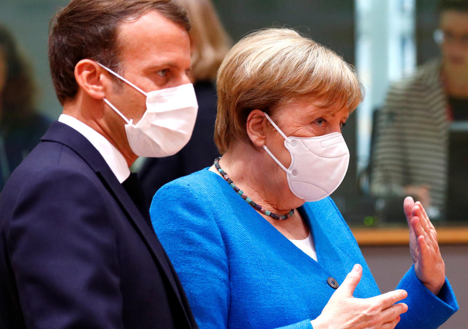 German Chancellor Angela Merkel and France's President Emmanuel Macron take part in the first face-to-face EU summit since the coronavirus disease (COVID-19) outbreak, in Brussels, Belgium July 18, 2020. REUTERS/Francois Lenoir/Pool