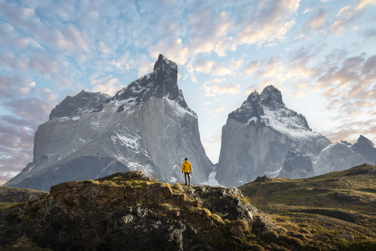 Hiker Admiring the Cuernos del Paine Range, Patagonia, Dramatic Image