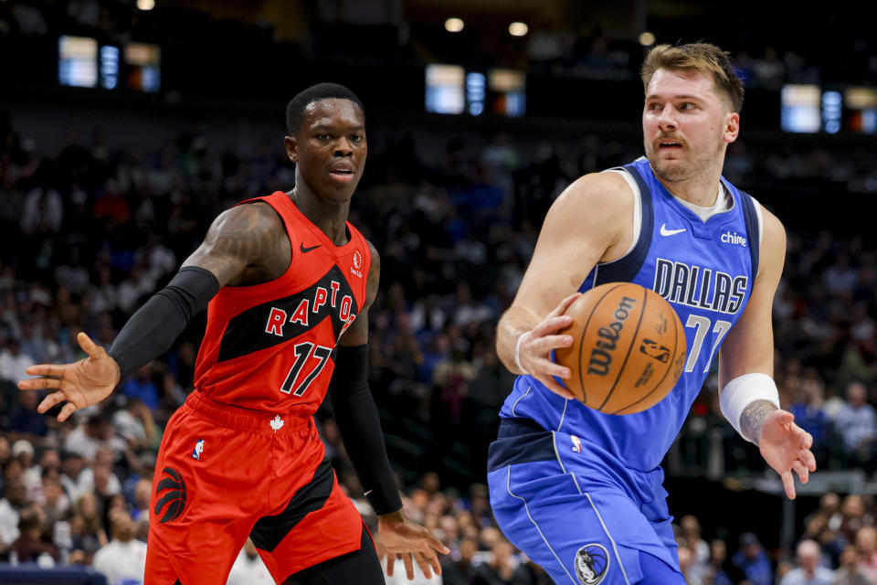 Dallas Mavericks guard Luka Doncic (77) looks around Toronto Raptors guard Dennis Schroder (17) during the second half of an NBA basketball game, Wednesday, Nov. 8, 2023, in Dallas. (AP Photo/Gareth Patterson)