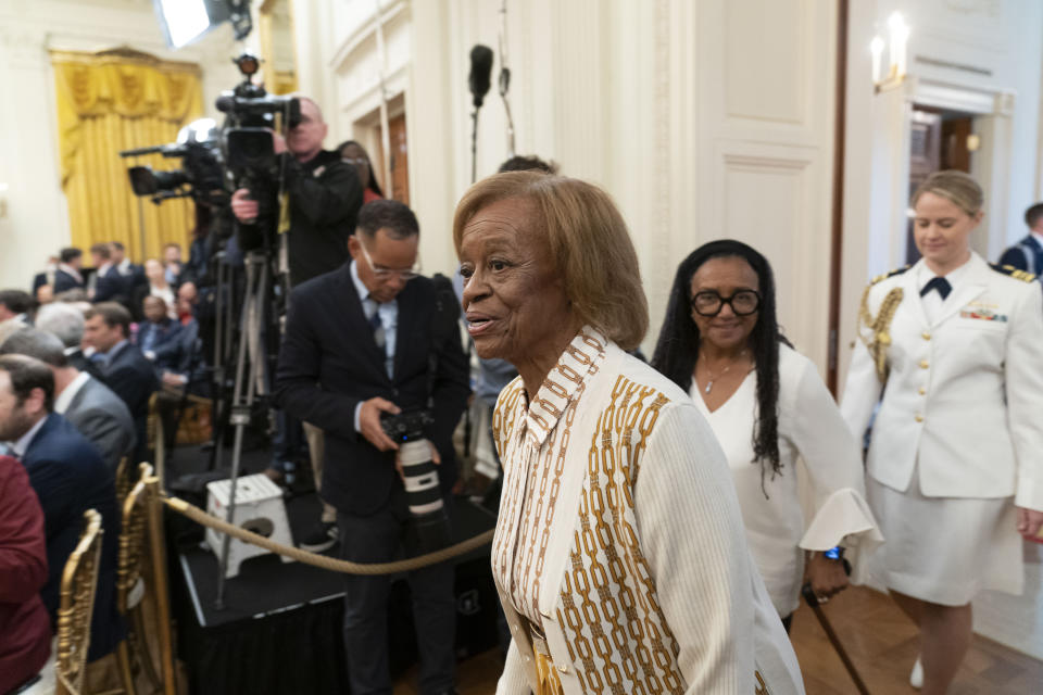 FILE - Former first lady Michelle Obama's mother Marian Robinson, center, arrives for a ceremony as President Joe Biden and first lady Jill Biden host former President Barack Obama and Michelle Obama for the unveiling of their official White House portraits in the East Room of the White House in Washington, Sept. 7, 2022. Robinson, who moved with the first family to the White House when son-in-law Barack Obama was elected president, has died, according to an announcement by Michelle Obama and other family members Friday, May 31, 2024. (AP Photo/Andrew Harnik, File)