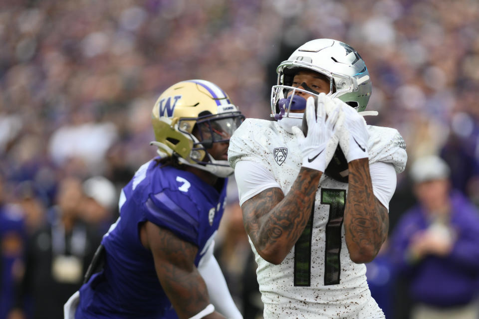 Oct 14, 2023; Seattle, Washington, USA; Oregon Ducks wide receiver Troy Franklin (11) catches a pass for a touchdown against the Washington Huskies during the second half at Alaska Airlines Field at Husky Stadium. Mandatory Credit: Steven Bisig-USA TODAY Sports