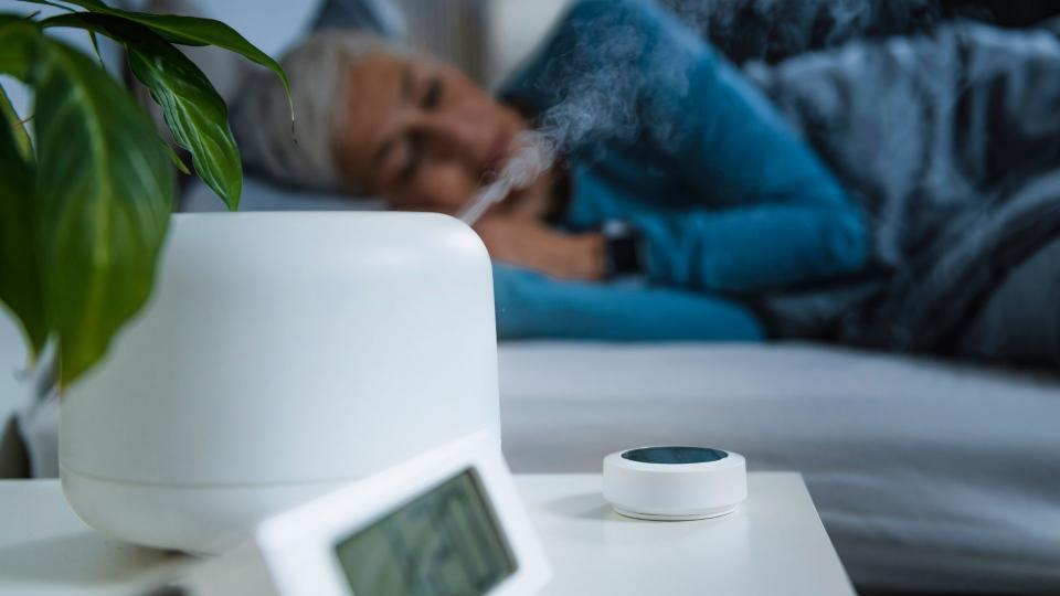 Woman napping with a humidifier on