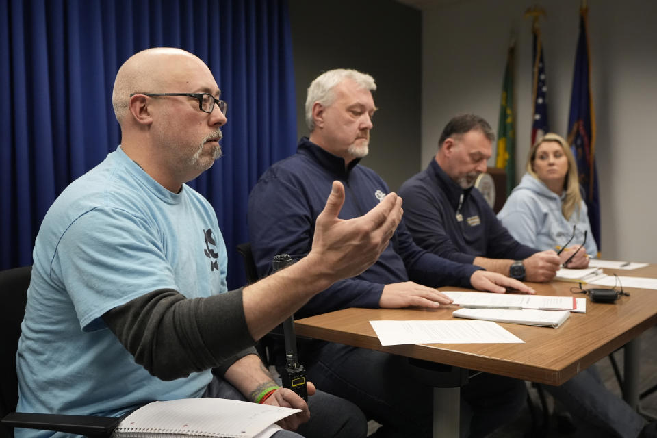 The parents of four students killed in a shooting in Michigan more than two years ago are interviewed Monday, March 18, 2024 in Pontiac, Mich. From left, Craig Shilling, Steve St. Juliana, Buck Myre and Nicole Beausoleil called for a state investigation of all aspects of the 2021 mass shooting, saying a local criminal probe that netted three is not enough to close the book. (AP Photo/Carlos Osorio)