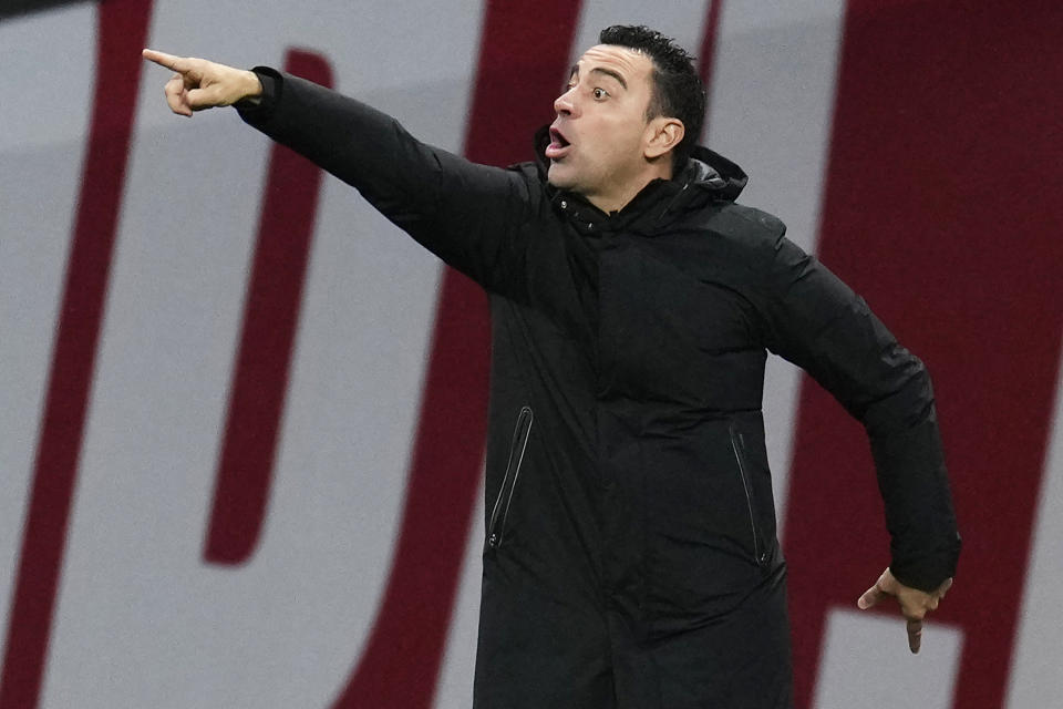 Barcelona's head coach Xavi Hernandez gestures during the Spanish La Liga soccer match between Atletico Madrid and FC Barcelona at Civitas Metropolitano stadium in Madrid, Spain, Sunday, Jan. 8, 2023. (AP Photo/Manu Fernandez)