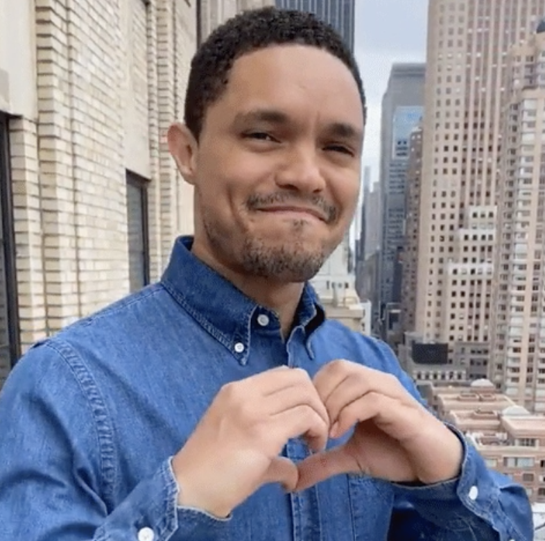 Trevor Noah on "The Daily Show" forming a heart with his hands