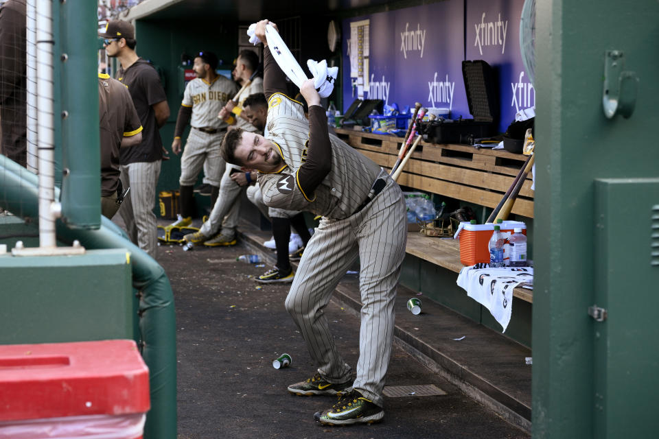 San Diego Padres starting pitcher Blake Snell stretches in the dugout during the fourth inning of the team's baseball game against the Washington Nationals, Thursday, May 25, 2023, in Washington. The Padres won 8-6. (AP Photo/Nick Wass)