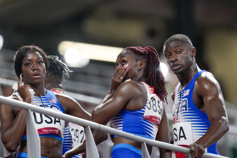 Lynna Irby of the United States wipes a tear away after the 4 x 400-meter mixed relay at the 2020 Summer Olympics, Friday, July 30, 2021, in Tokyo. (AP Photo/Petr David Josek)