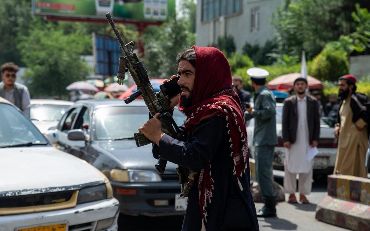 Taliban fighters fired into the air as women marched in front of the education building in Kabul on the eve of the one-year anniversary of its seizure of power - Nava Jamshidi 