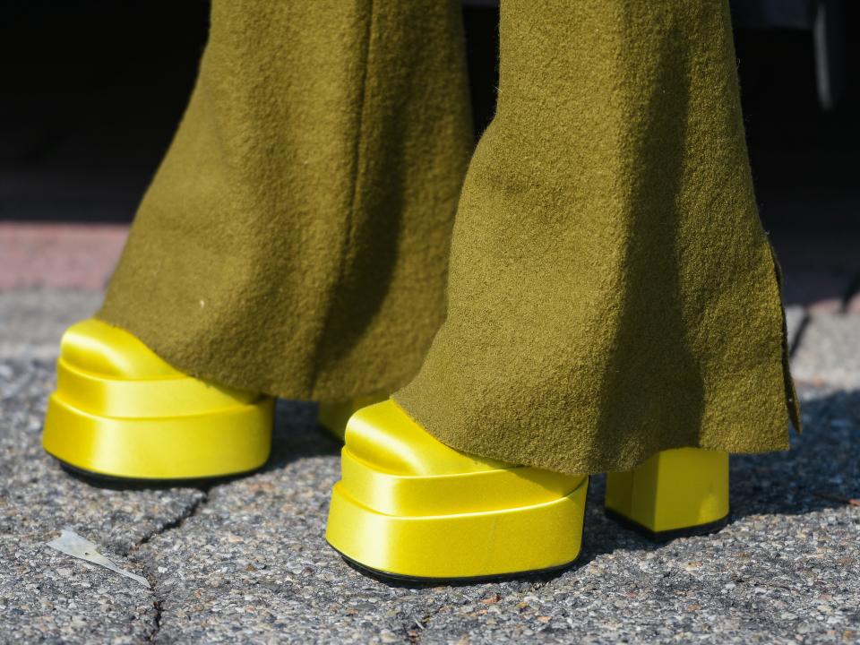 lime green platform boots with long dark green pants