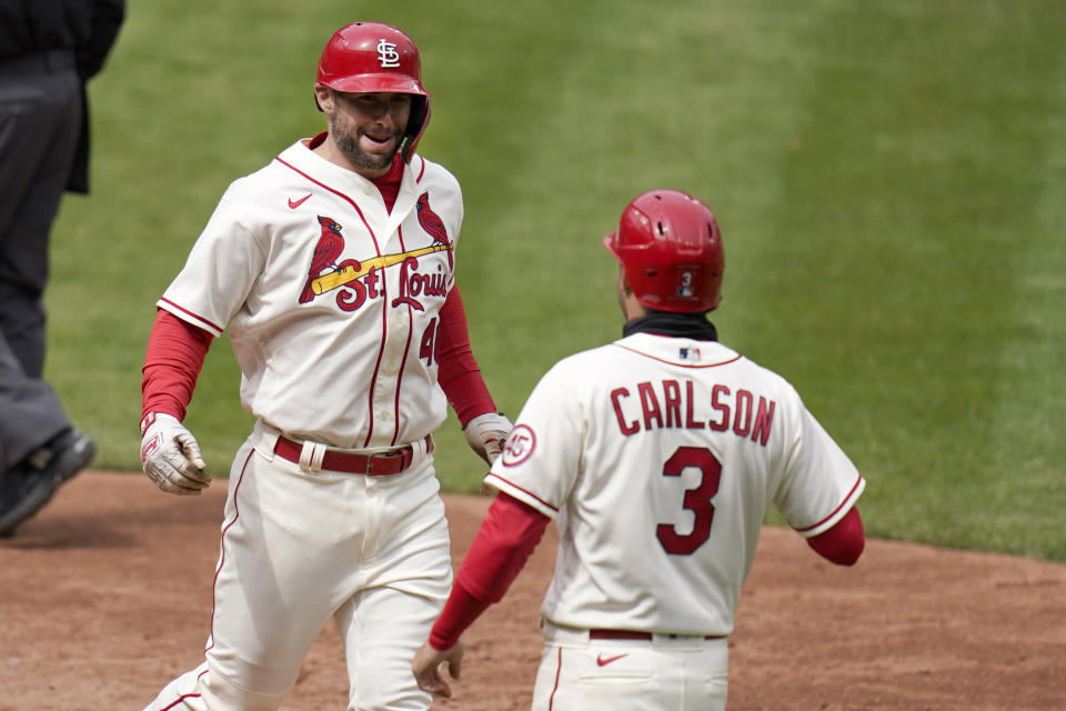 St. Louis Cardinals' Paul Goldschmidt, left, is congratulated by teammate Dylan Carlson (3) after hitting a two-run home run during the fifth inning of a baseball game against the Colorado Rockies Saturday, May 8, 2021, in St. Louis. (AP Photo/Jeff Roberson)