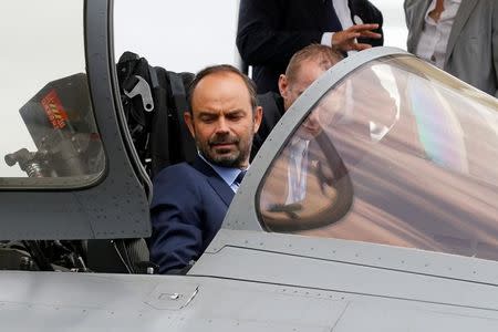 French Prime Minister Edouard Philippe sits in the cockpit of Dassault Rafale fighter as he visits the 52nd Paris Air Show at Le Bourget Airport near Paris, France June 23, 2017. REUTERS/Pascal Rossignol