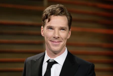 Actor Benedict Cumberbatch smiles as he arrives at the 2014 Vanity Fair Oscars Party in West Hollywood, California March 3, 2014. REUTERS/Danny Moloshok