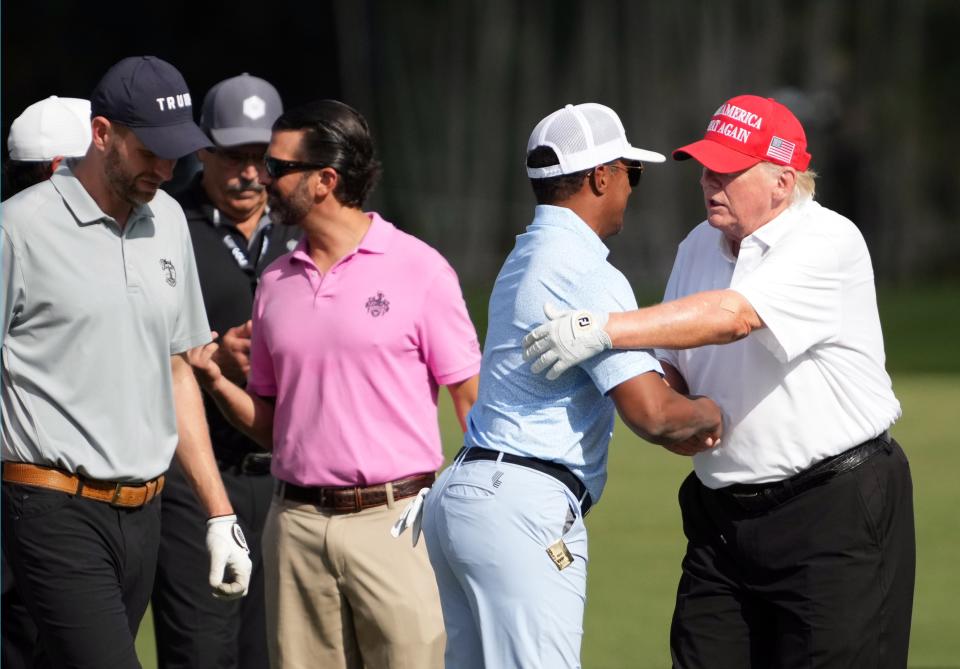 Oct 27, 2022; Miami, Florida, USA; CEO of Saudi golf Majed Al Surour hugs Donald Trump during the Pro-Am tournament before the LIV Golf series at Trump National Doral. Mandatory Credit: Jasen Vinlove-USA TODAY Sports