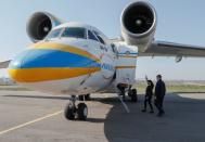 Ukrainian medical personnel depart for coronavirus-hit Italy at an airport in Kiev