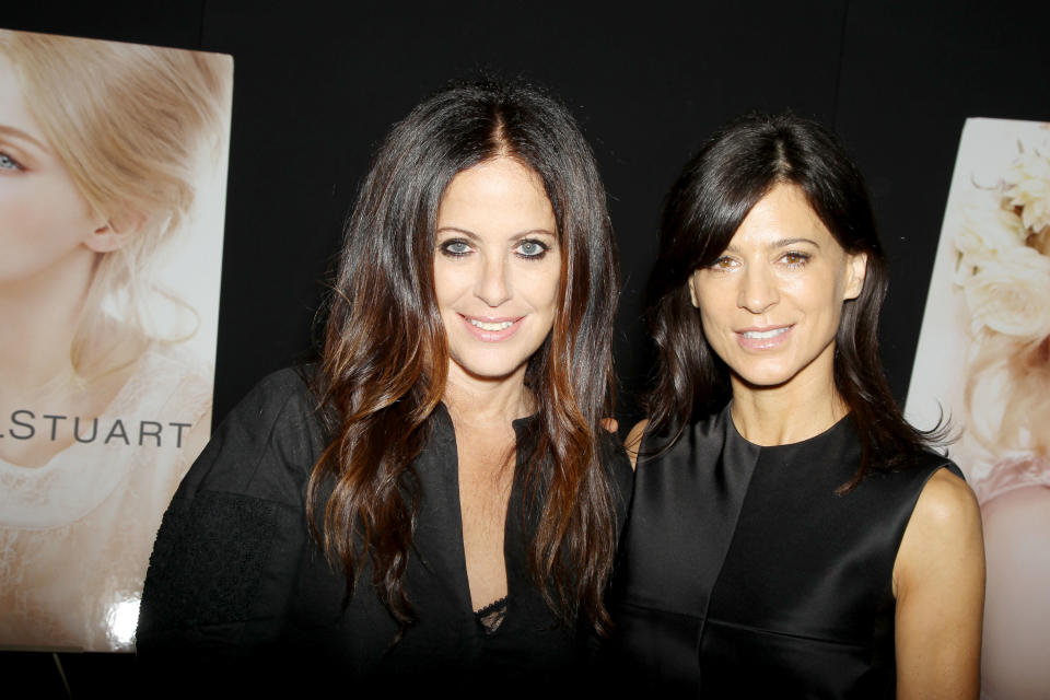 This image released by Starpix shows designer Jill Stuart, left, and Perrey Reeves at the Jill Stuart Spring 2014 show during Fashion Week in New York, Saturday, Sept. 7, 2013. (AP Photo/Starpix, Marion Curtis)