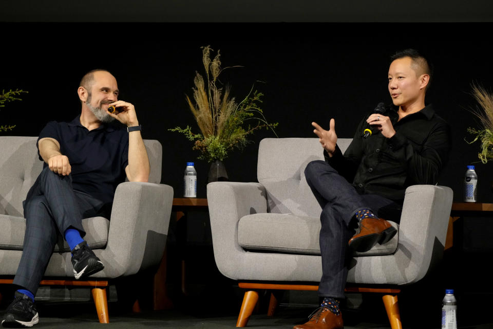 LOS ANGELES, CALIFORNIA - DECEMBER 04: (L-R) Craig Mazin and Alex Wang speak onstage at "The Last of Us" FYC Event at Paramount Theatre on December 04, 2023 in Los Angeles, California. (Photo by Jeff Kravitz/FilmMagic for HBO)