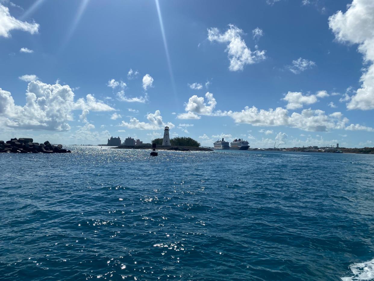 Open water with a lighthouse in the background in The Bahamas