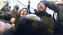 This image from video from a police worn body camera from the Jan. 6 riot at the U.S. Capitol, was played as a committee exhibit as the House select committee investigating the the Jan. 6 attack on the U.S. Capitol, held a hearing Thursday, June 9, 2022, on Capitol Hill in Washington. (House Select Committee via AP)
