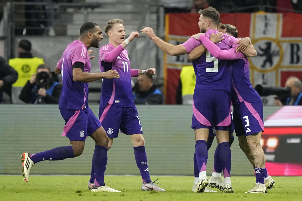 Germany's Niclas Fullkrug celebrates with teammates after scoring his sides second goal during the international friendly soccer match between Germany and Netherlands at the Deutsche Bank Park in Frankfurt, Germany on Tuesday, March 26, 2024. (AP Photo/Martin Meissner)